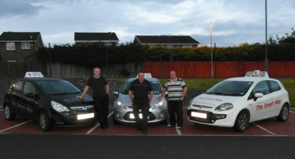 The rouges gallery! 
        Three of our instructors with their vehicles