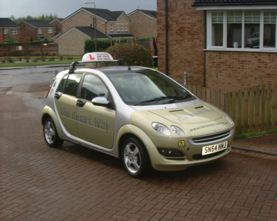 A nice view of our automatic car, the smart forfour in pale green, striking with is silver livery